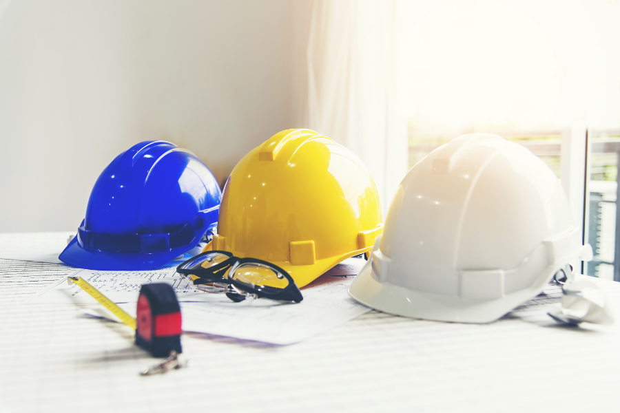 Yellow construction helmet with site safety equipment